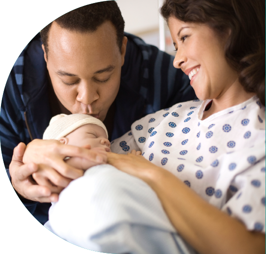 father and mother with baby